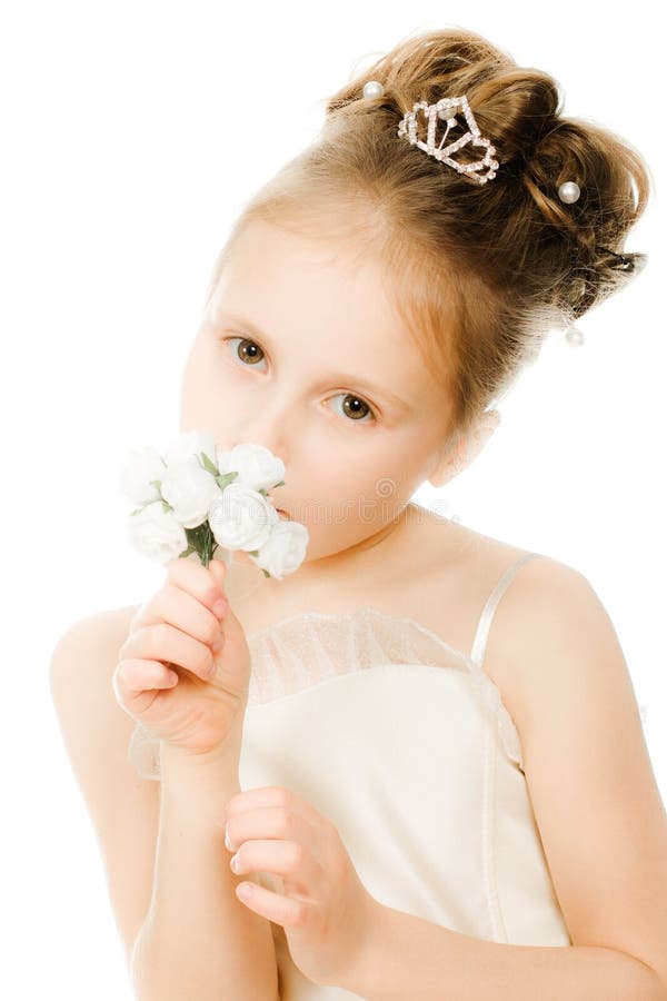 Beautiful girl in white dress with a flower