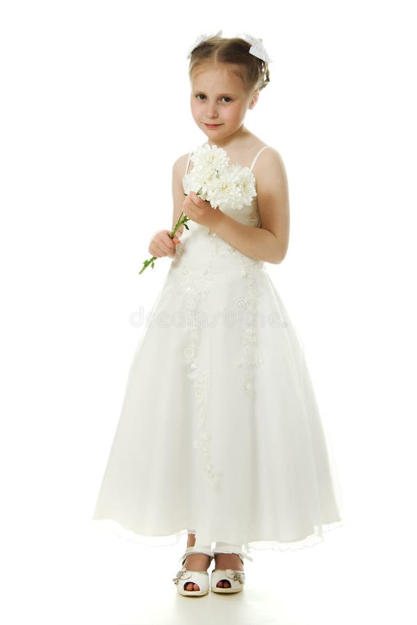 Beautiful girl in white dress with a flowers