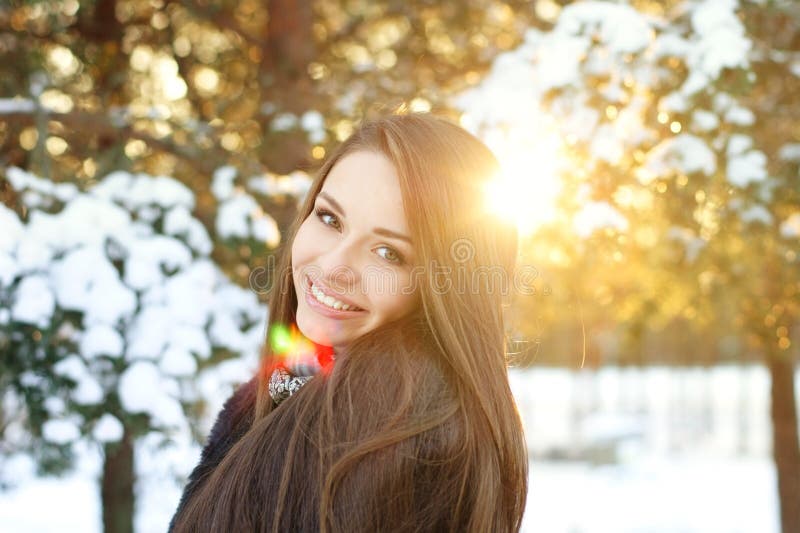 Beautiful girl in winter forest royalty free stock photo