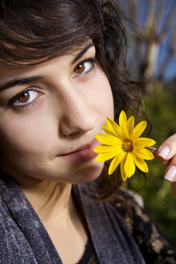 Beautiful Girl with Yellow Flower Stock Image Image of smelling