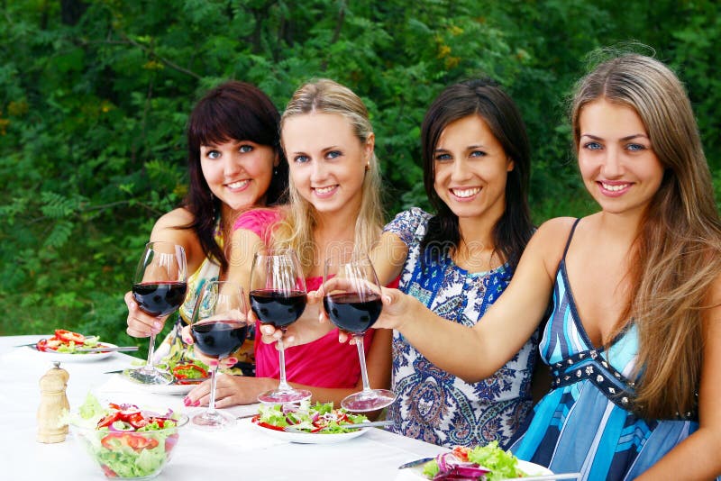 Beautiful girls drinking wine