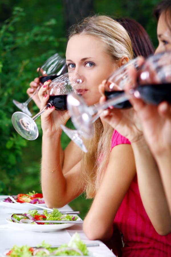 Beautiful girls drinking wine