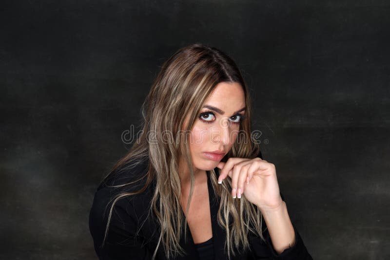 Beautiful, glamourous blonde girl posing in studio on isolated background. Style, trends, fashion concept.