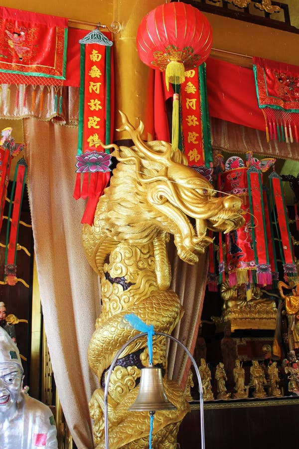 Beautiful Golden Buddhist statue dragon with a red cloth royalty free stock photography