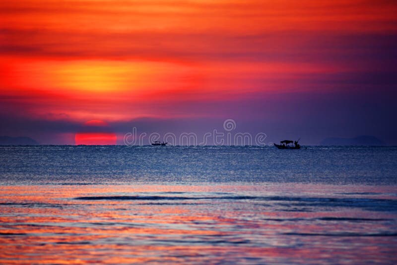 Beautiful golden sunset landscape, orange sky, blue sea, yellow sun, sunset ocean beach, scenery seascape, Thailand, Samui island