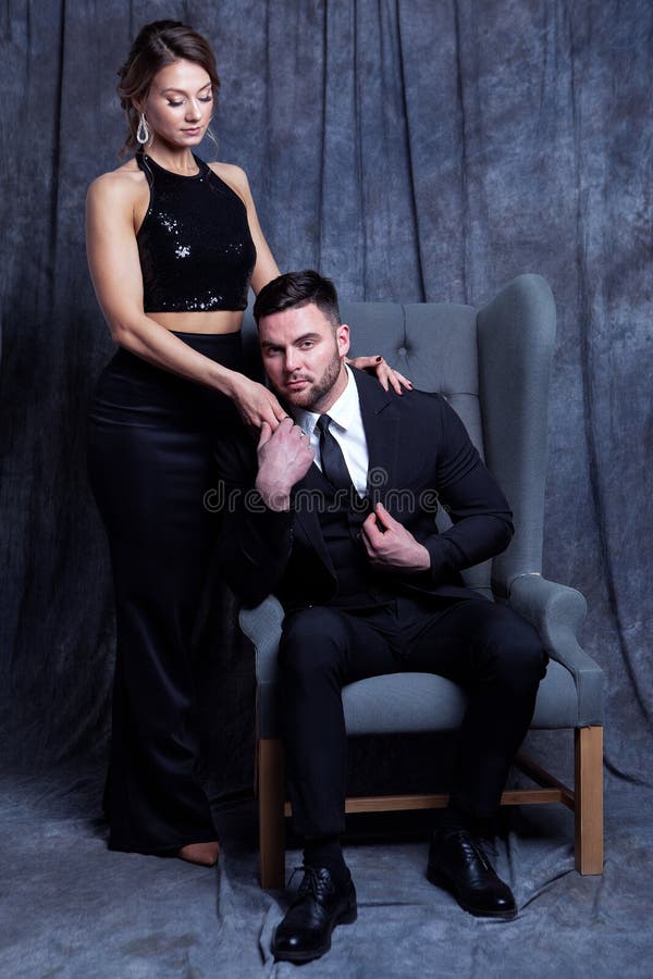 Beautiful gorgeous couple in elegant evening dresses. Fashion, glamour stock photo Beautiful gorgeous couple in elegant evening dresses. Fashion, glamour stock photo