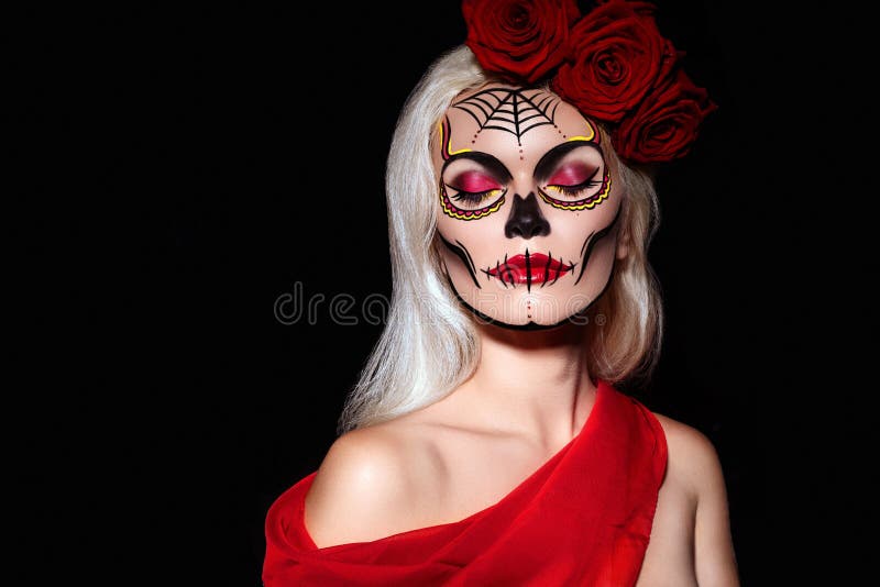 beautiful halloween make up style blond model wear sugar skull makeup red roses santa muerte concept pale skin tones 129882273