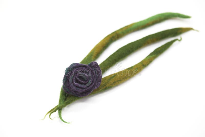 Beautiful hand-made brooch felted wool sheep, blue-green shades on a white background. stock photography Beautiful hand-made brooch felted wool sheep, blue-green shades on a white background. stock photography