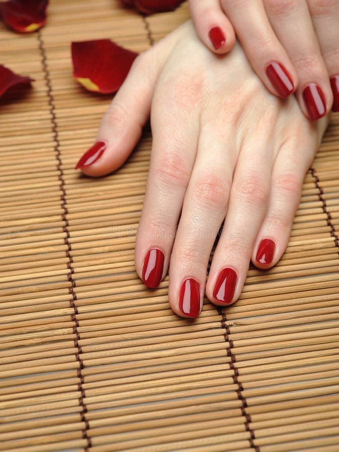 Beautiful hand with perfect nail red manicure