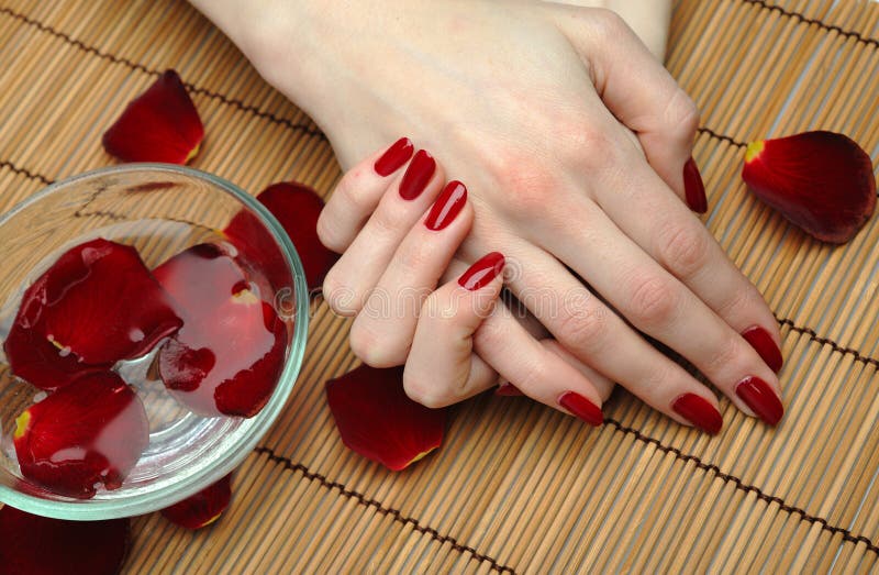 Beautiful hand with perfect nail red manicure