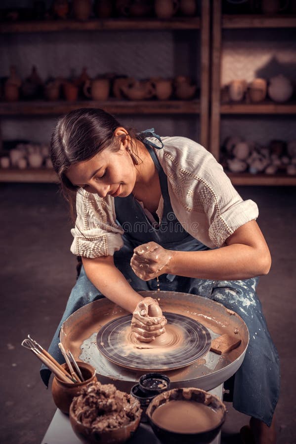 Stylish Pottery Woman Siting on Bench with Pottery Wheel and Making Clay  Pot. National Craft. Stock Photo - Image of handicrft, shape: 147147962