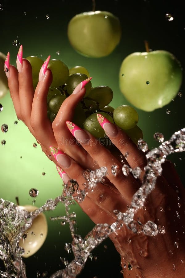 Beautiful hands and nails on green background