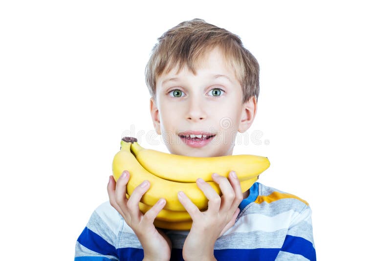 Beautiful happy child in stylish t-shirt holds a bunch of bananas