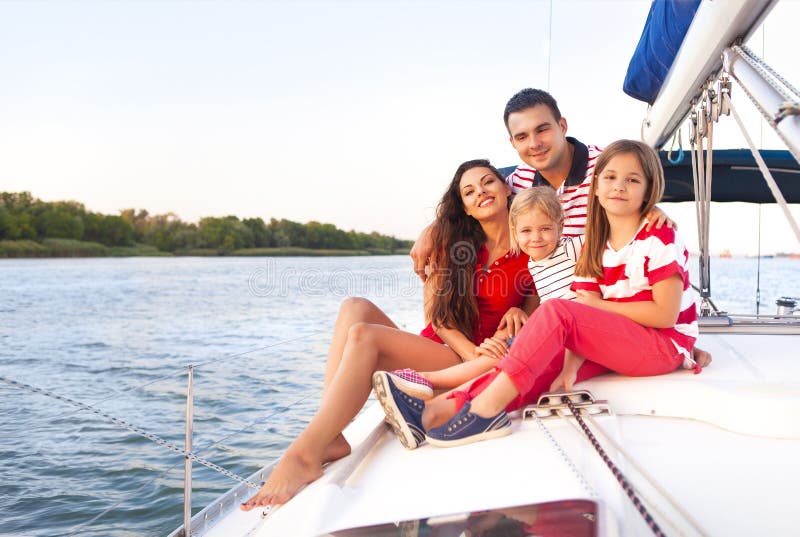 Beautiful happy family with two daughters having great time at t stock photography Beautiful happy family with two daughters having great time at t stock photography