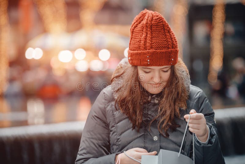 Beautiful happy girl goes shopping with paperbags after shopping in the city stock image Beautiful happy girl goes shopping with paperbags after shopping in the city stock image