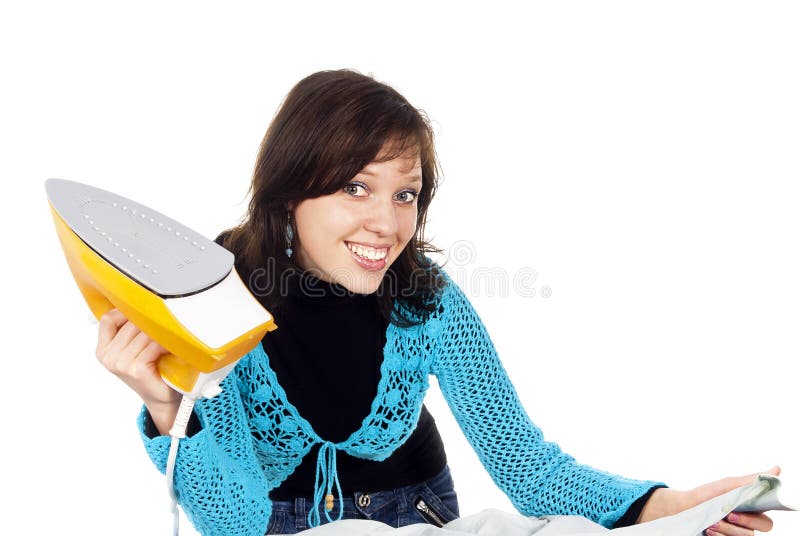 Beautiful happy girl ironing clothes