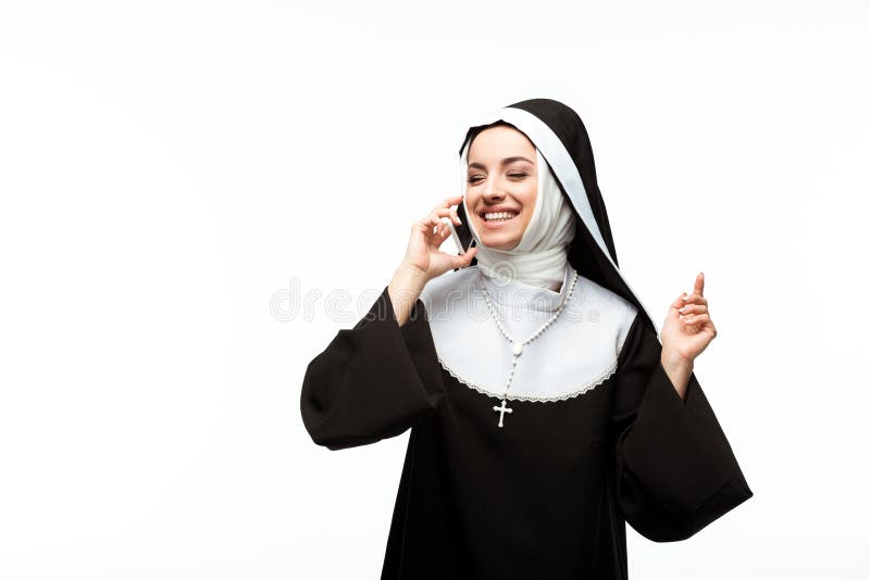 Beautiful happy nun talking on smartphone royalty free stock photos Beautiful happy nun talking on smartphone royalty free stock photos
