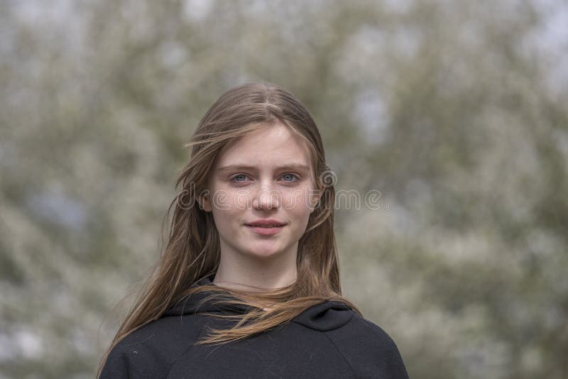 Beautiful happy young girl in nature. Close up portrait