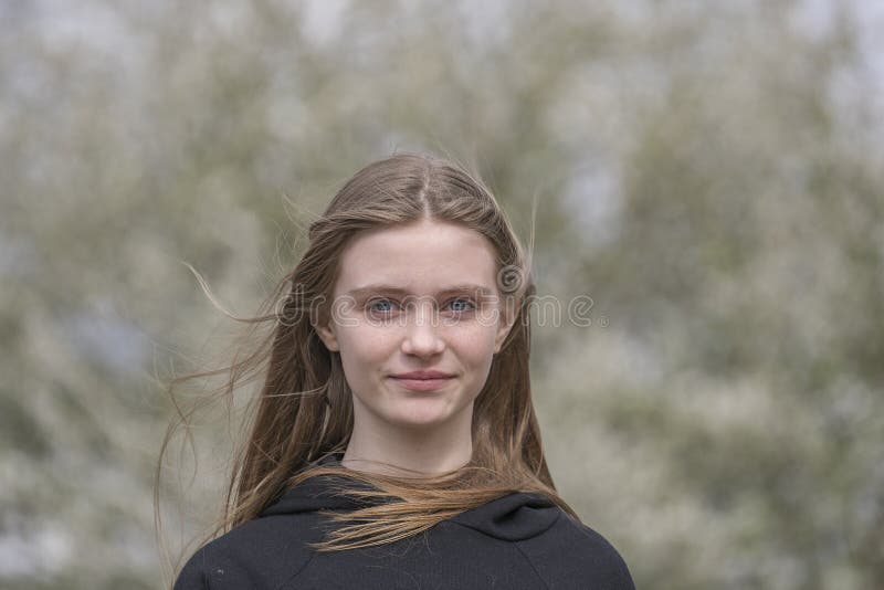 Beautiful happy young girl in nature. Close up portrait