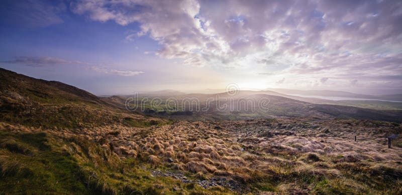 Beautiful hazy sunset at the foot of the Mount Gabriel stock photo Beautiful hazy sunset at the foot of the Mount Gabriel stock photo