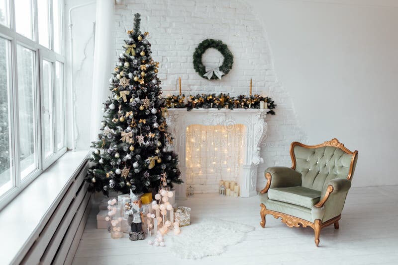 Beautiful holiday decorated room with Christmas tree with present boxes under it in white and blue stock photography