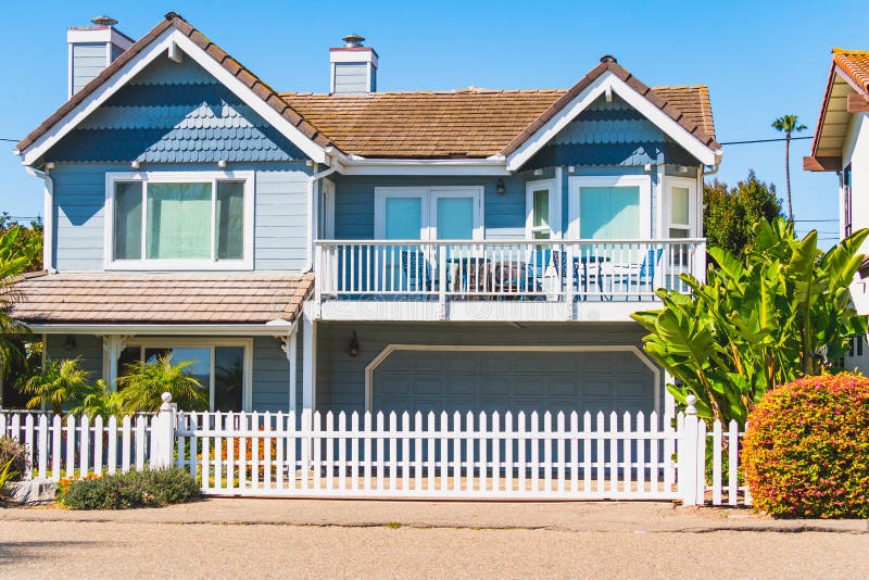 Beautiful House With Nicely Landscaped Front The Yard And Clear Blue