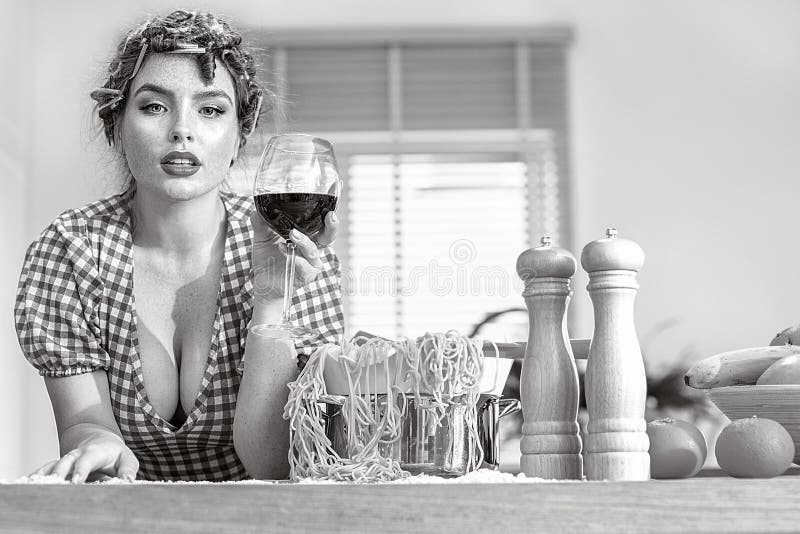 Beautiful Housewife in the Kitchen Stock Photo