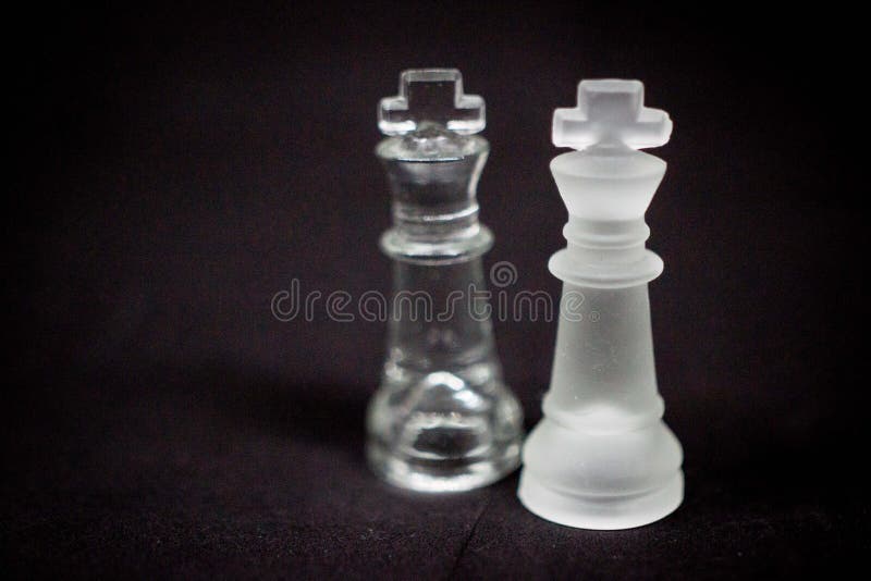 Dramatic, Twin King Chess pieces on a black Background stock photography