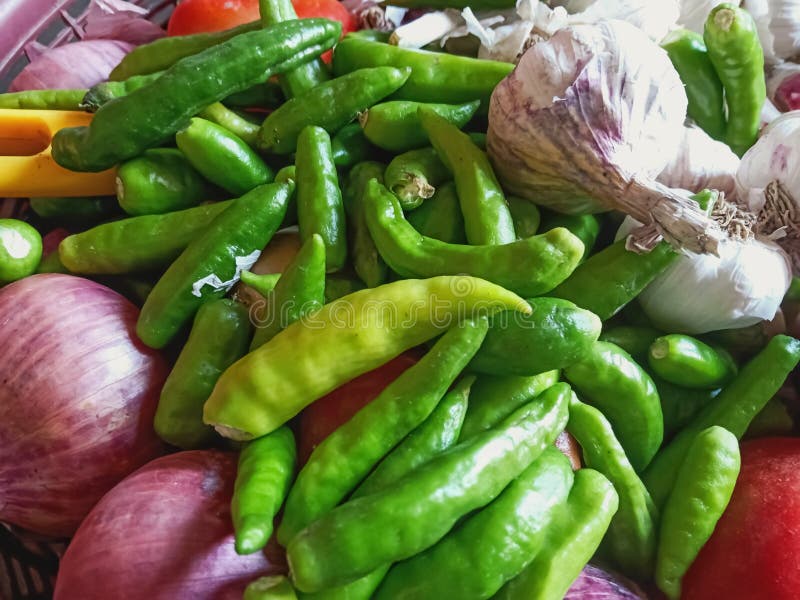 Beautiful Image of Green Chilli,onion , Tomato and Garlic in Basket