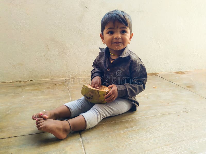 Beautiful Indian Kid Eating Tender Coconut by Hand Stock Image - Image ...