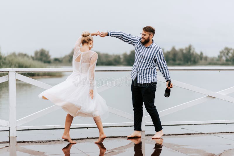 Beautiful Just Married Dance Barefoot And Have Fun On The Pier By The 