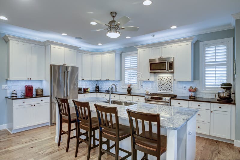 Beautiful kitchen remodel with white cabinets and new appliances