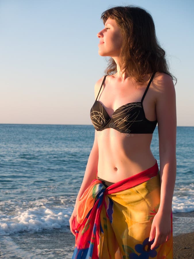 Beautiful lady in Bikini on Beach Sunset