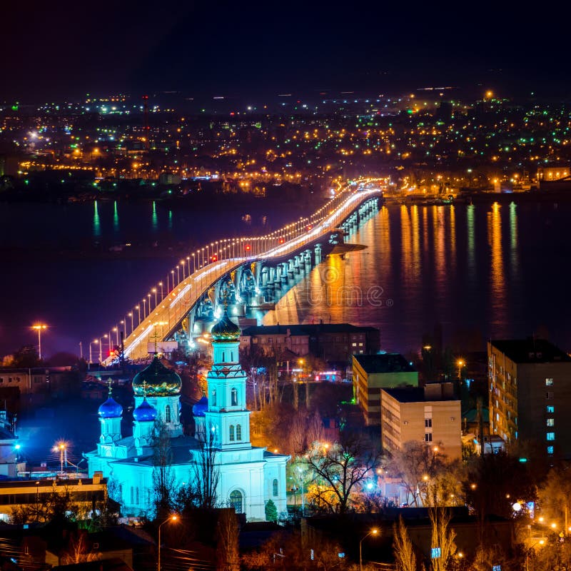 Beautiful landscape of evening city Saratov with church and brid