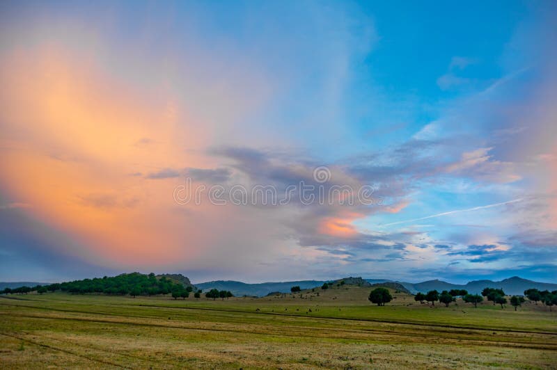 Beautiful landscape with green trees and a dramatic sky after the rain royalty free stock photos