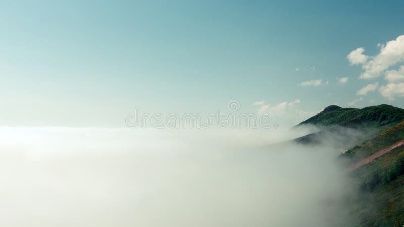 Beautiful landscape nature in morning on peak mountain with sunlight cloud fog and bright blue sky