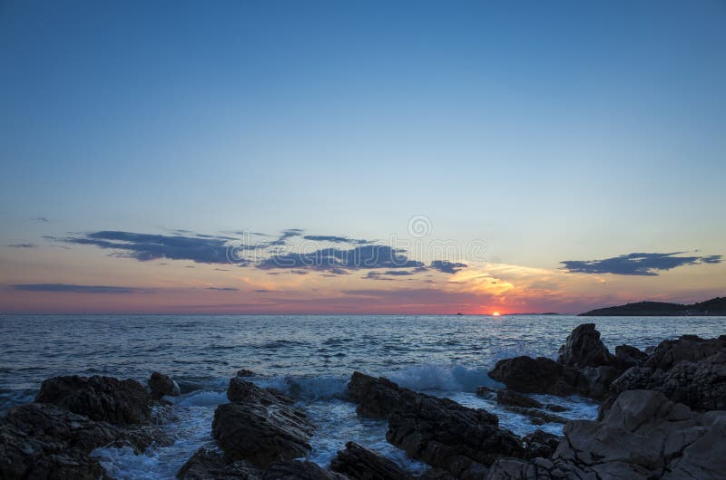 Beautiful landscape and nature photo of sunset at Adriatic Sea in Croatia Europe.