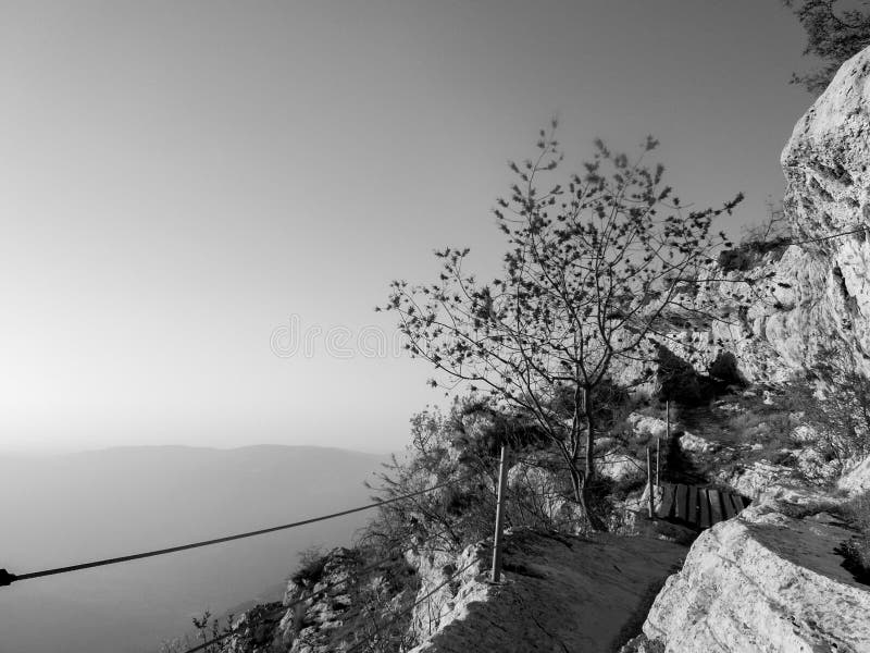 black and white Beautiful landscape in Niha , the lebanese village with green grass and yellow trees and bright blue magical sky. black and white Beautiful landscape in Niha , the lebanese village with green grass and yellow trees and bright blue magical sky