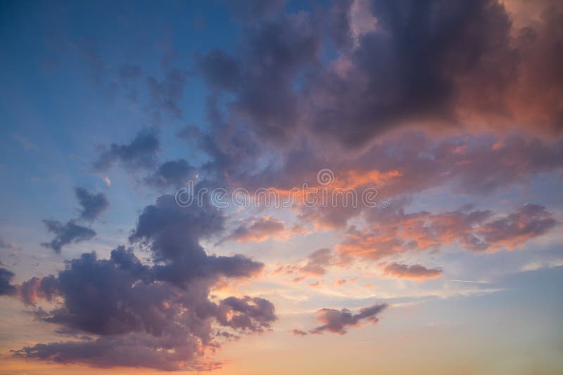 Beautiful Landscape of Pink, Purple and Yellow Clouds in Blue and Yellow Sky at Sunset