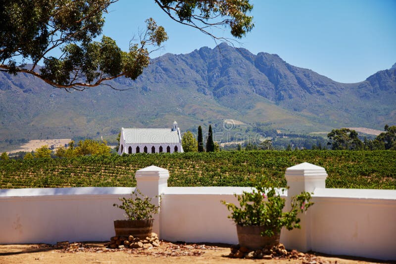 Beautiful landscape of a small white chapel amid a vineyard in Tulbagh, South Africa, on a sunny day