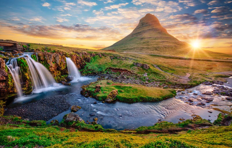Beautiful landscape with sunrise on Kirkjufellsfoss waterfall and Kirkjufell mountain, Iceland.
