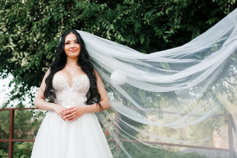 Beautiful, with a Large Bust, the Bride in a Wedding Dress Poses for the  Camera. Girl in White Dress Stock Image - Image of girl, elegant: 270787999