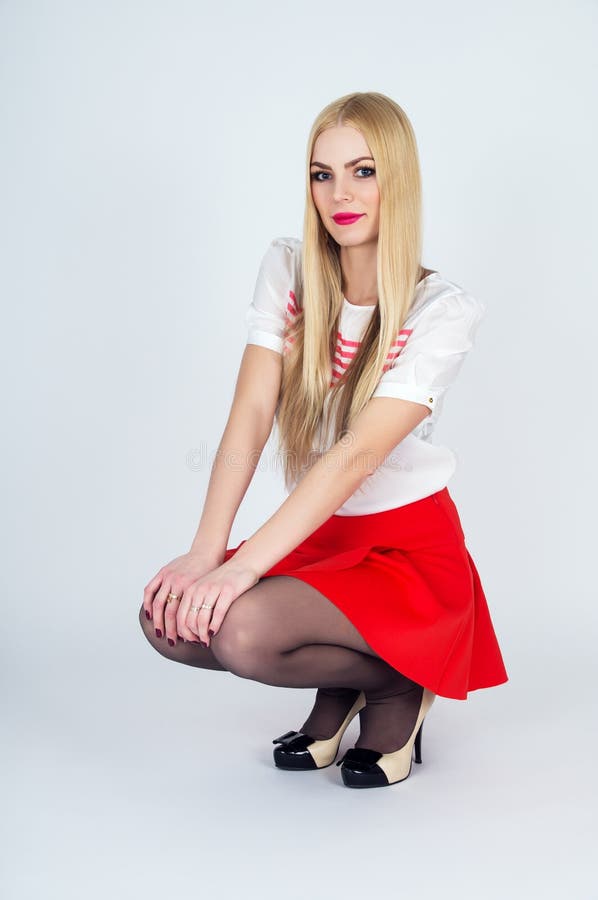 Beautiful Leggy Blonde Posing On A Gray Background Stock Image Image