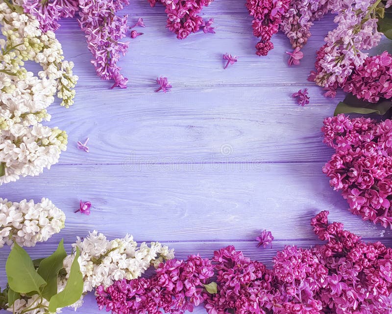 Beautiful lilac flower pattern decor arrangement on wooden background celebration frame