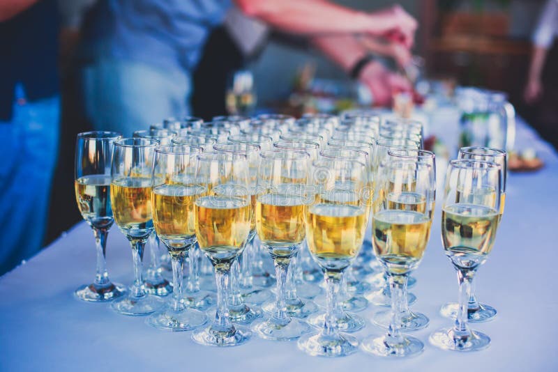 Beautiful line of different colored alcohol cocktails with smoke on a Christmas party, tequila, martini, vodka, and others on part stock image Beautiful line of different colored alcohol cocktails with smoke on a Christmas party, tequila, martini, vodka, and others on part stock image