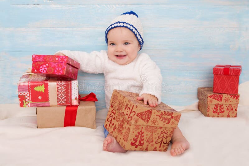 Beautiful little baby with gift