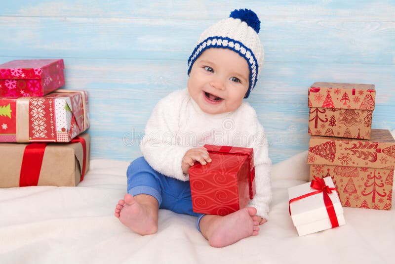 Beautiful little baby with gift
