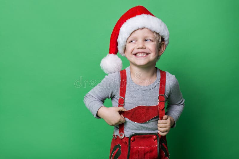 Beautiful little boy dressed like Christmas elf with big smile. Christmas concept