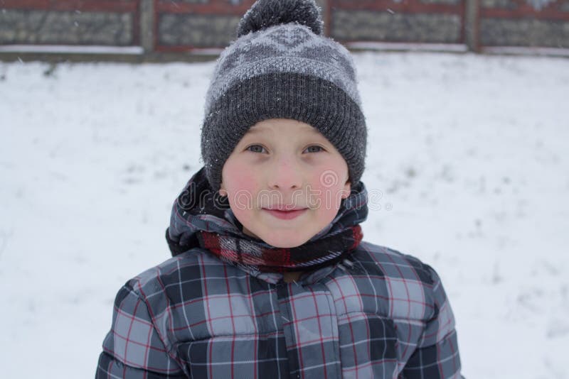 Beautiful little boy in winter,portrait of little boy with rosy cheeks in winter