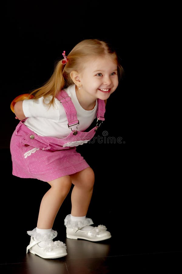 Little Girl on a Black Background Stock Photo - Image of daughter ...